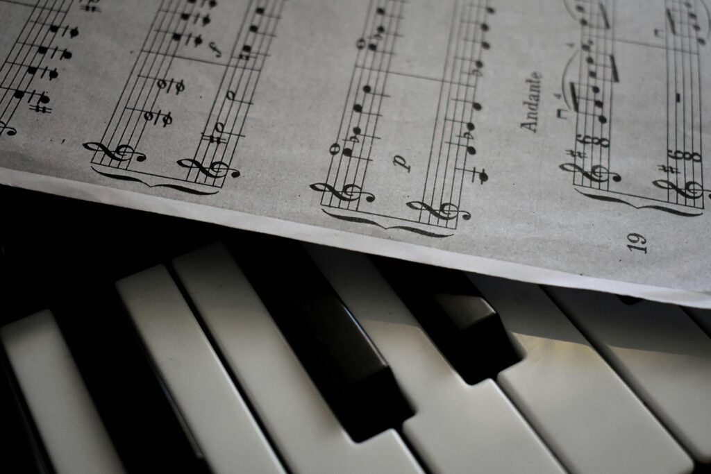 A detailed view of piano keys alongside a sheet of musical notation, emphasizing harmony.